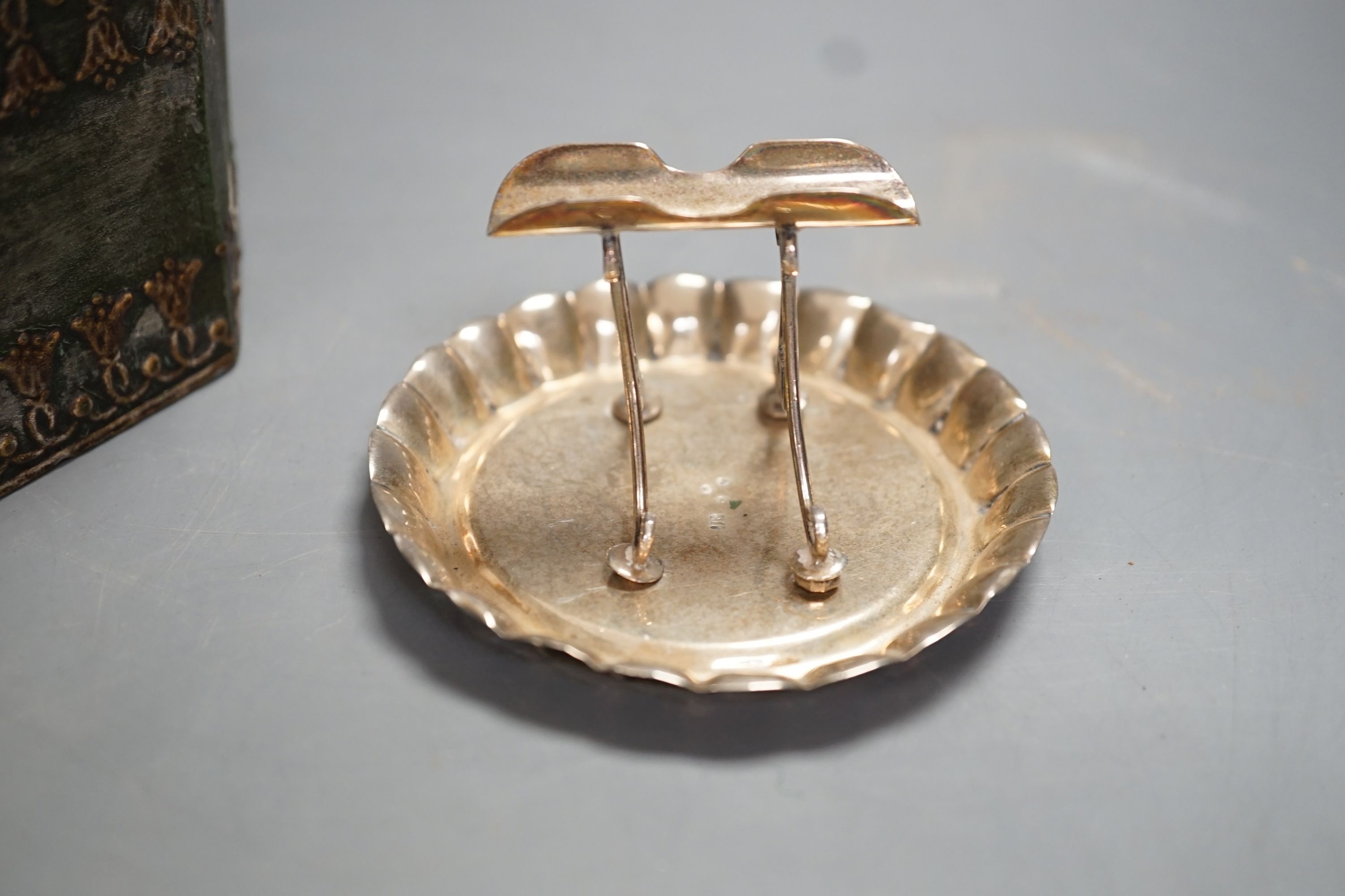 A Regency octagonal lead tobacco box, weight and cover, with slave-head finial, 14cm tall, and late Victorian silver cigarette holder